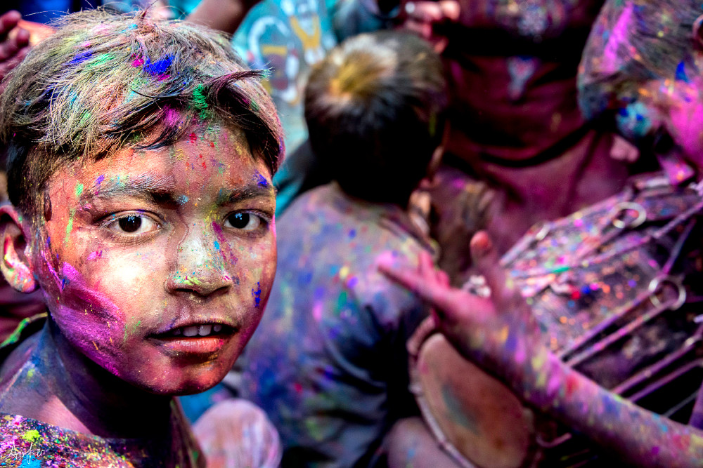 Portrait of boy with color on his face during the Holi celebrations, art photograph