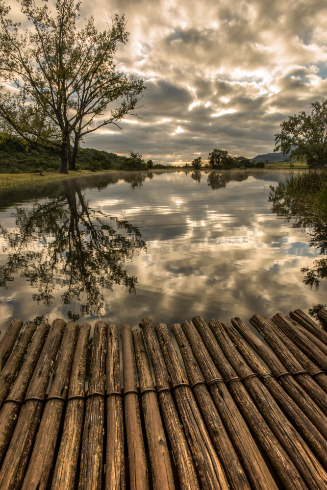 A wood bridge with morning cloudscape, in water reflection, photograph art print