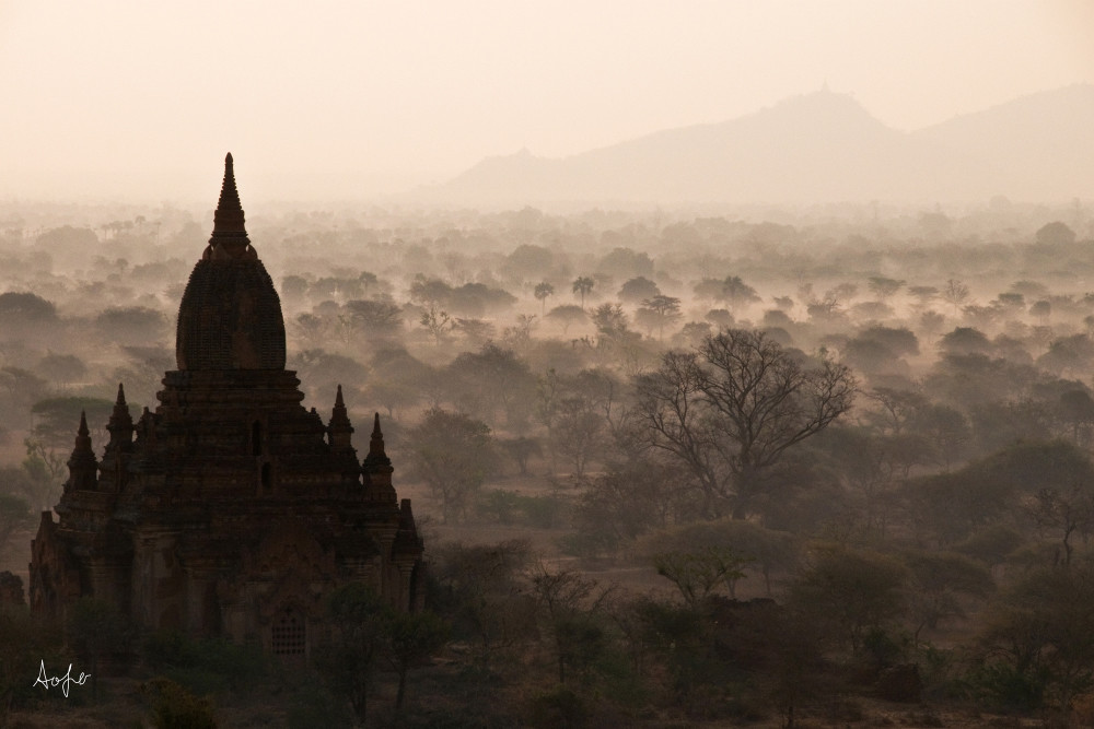 Silhouetted Buddhist ruin, fine art photograph from the air