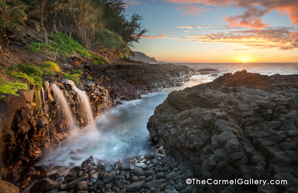 Queen's Bath double Waterfall in Kauai at sunset