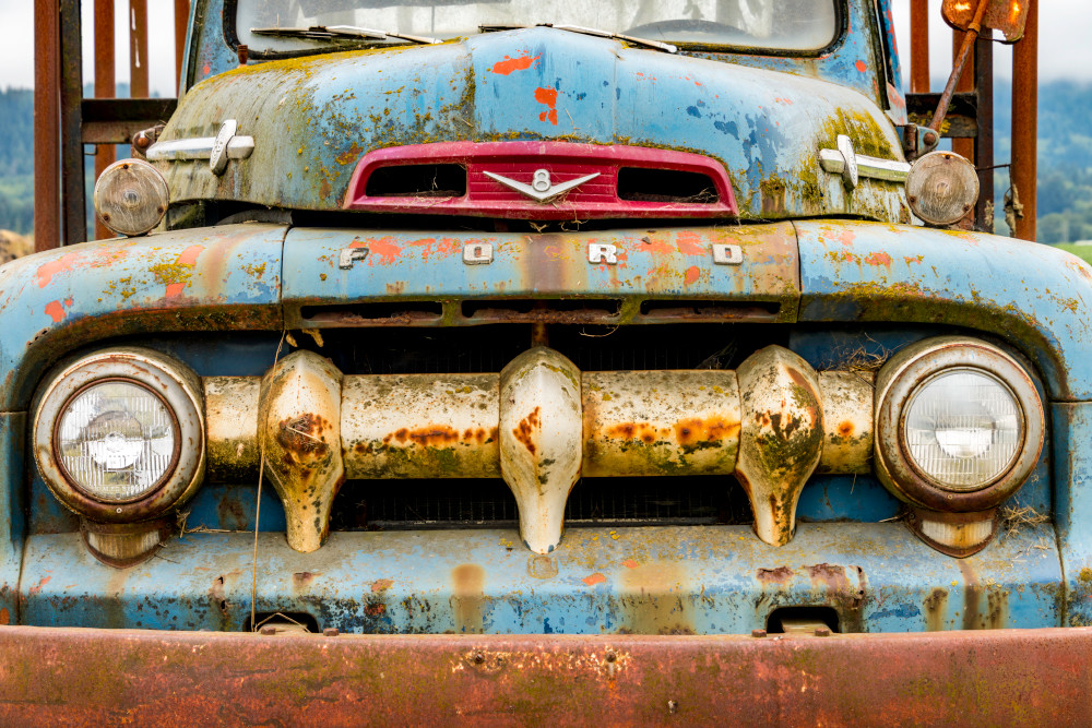 Rustic Ford truck with large grille from front in art photograph