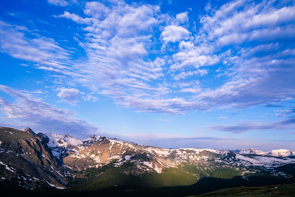 Patterned clouds above peaks by James Frank Photography
