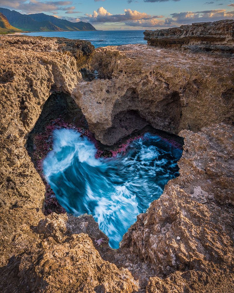 Dramatic color photo of swirling tide pool in heart shape
