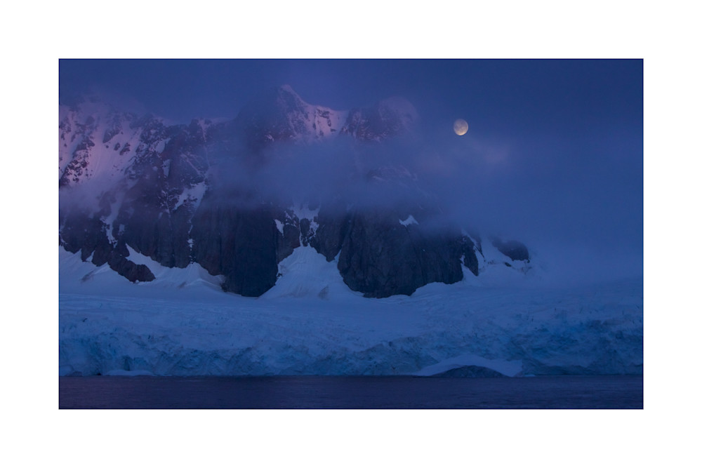 Photograph of Antarctic mountains and the moon.