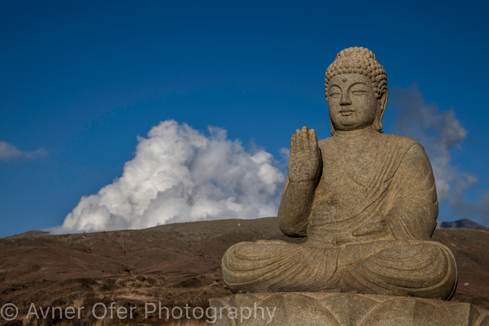 Buddha statue in front of Aso Volcano