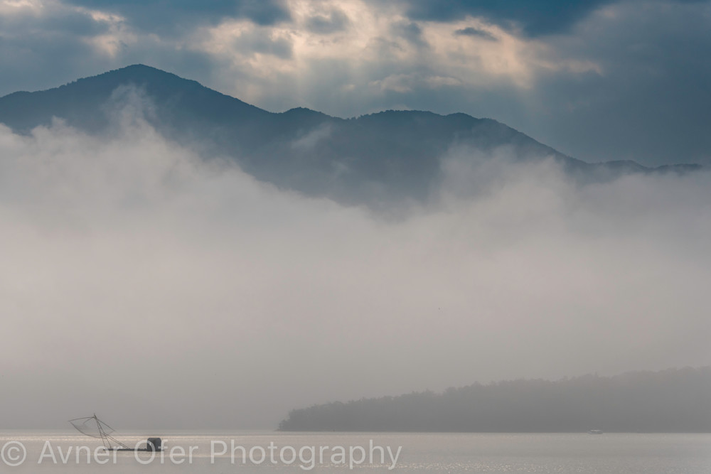 Traditional fishing net in the mist, Sun Moon Lake, Taiwan