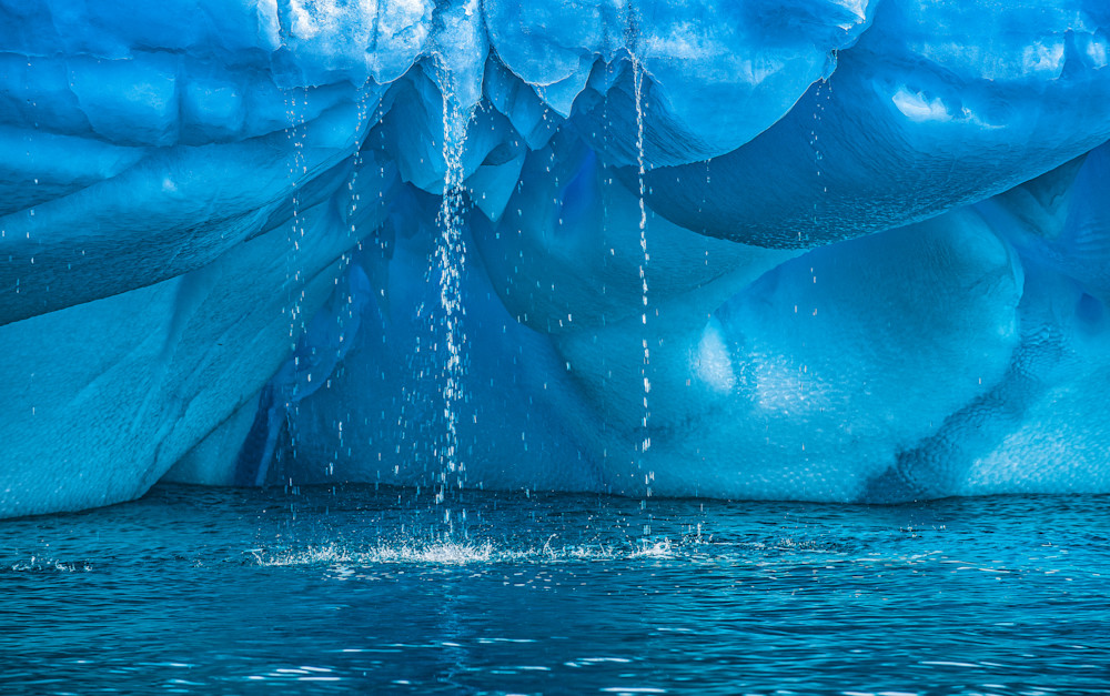 Water dropping from large blue Iceberg print for sale by Judith Barath.
