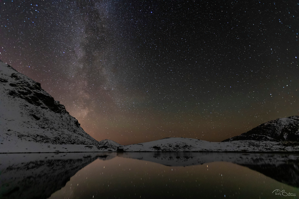 Milky Way and the afterglow of sunset over Summit Lake in Hatcher Pass in Sourthcentral Alaska. Autumn. Evening.