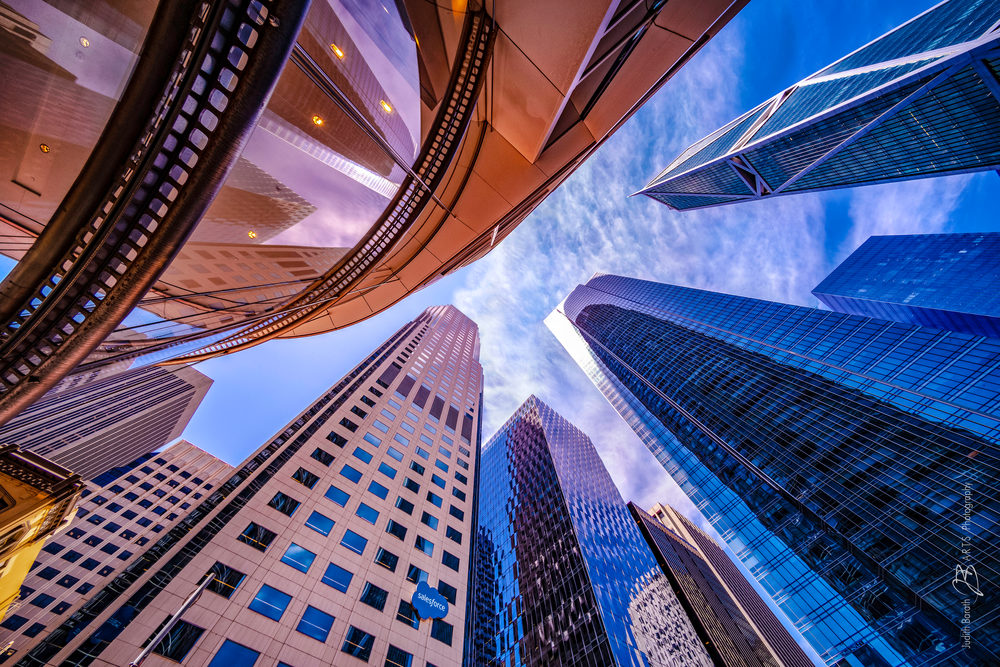 Worm's eye view photo of Salesforce Tower area highrise buildings by Judith Barath