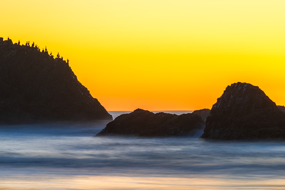 Photograph of the sunset at Seal Rock beach on the Oregon coast. 
