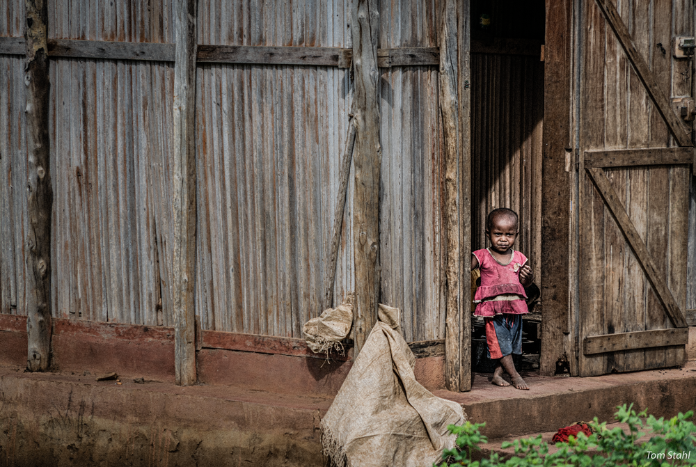 Girl in a doorway, Nosy Be, Madagascar, 2019.