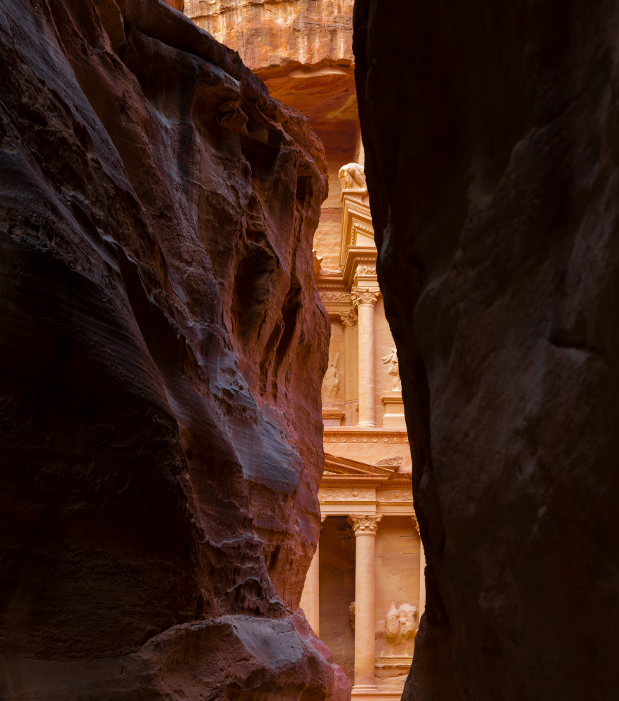 Petra, Jordan, looking through a narrow canyon at the Treasury
