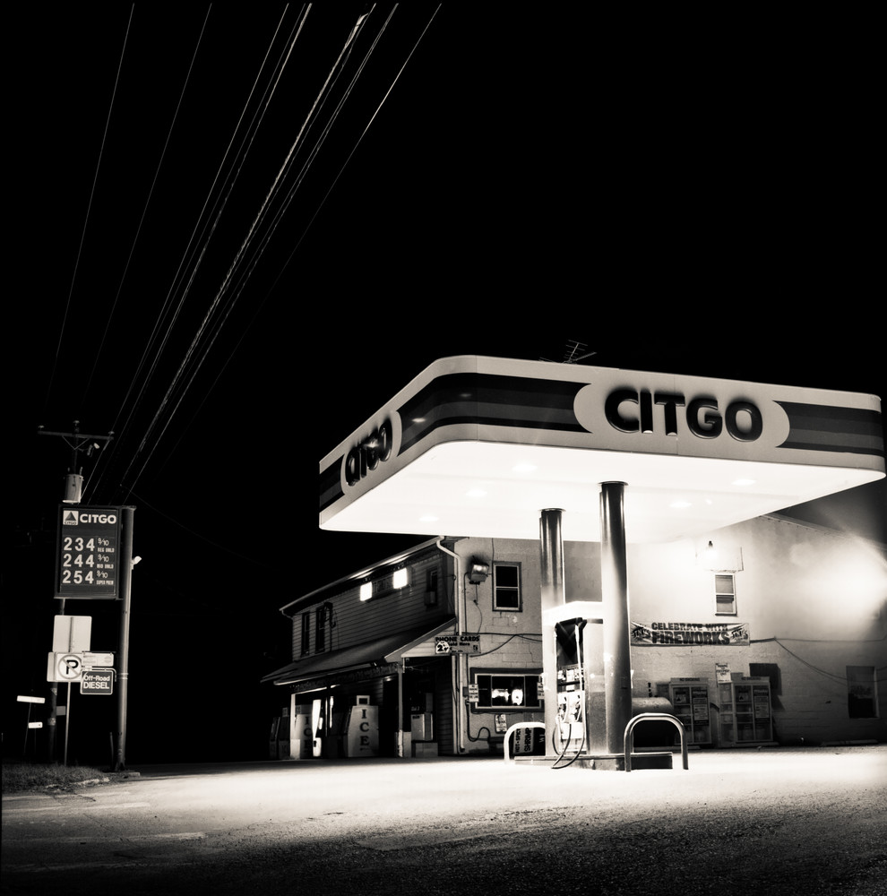 Night photograph of a lonly gas station in rural town America.