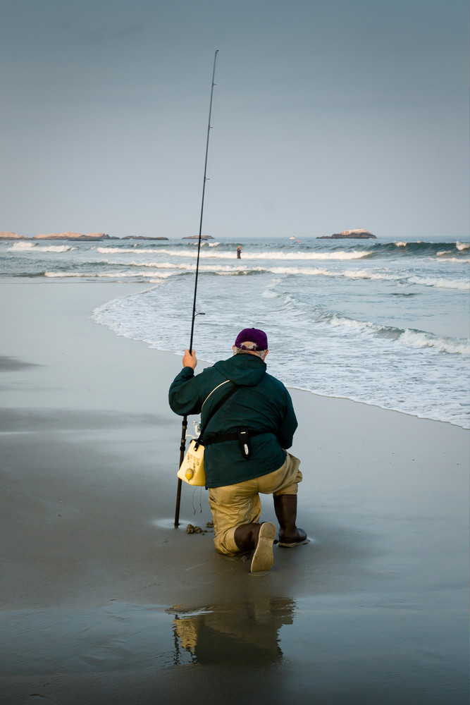 A fisherman on the town beach at Narragansett, Rhode Island.