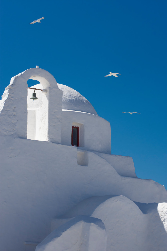 White church with dome ion Mykonos, Greece