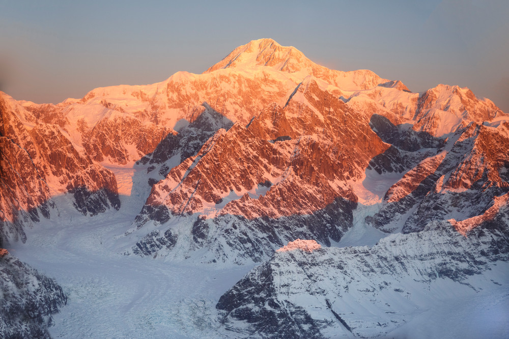 Winter landscape of first light on the summit of Denali (Mt. Mckinley) with glaciers and other Alaska Range Mountains below. Denali National Park, Alaska

Photo by Jeff Schultz/SchultzPhoto.com  (C) 2017  ALL RIGHTS RESVERVED