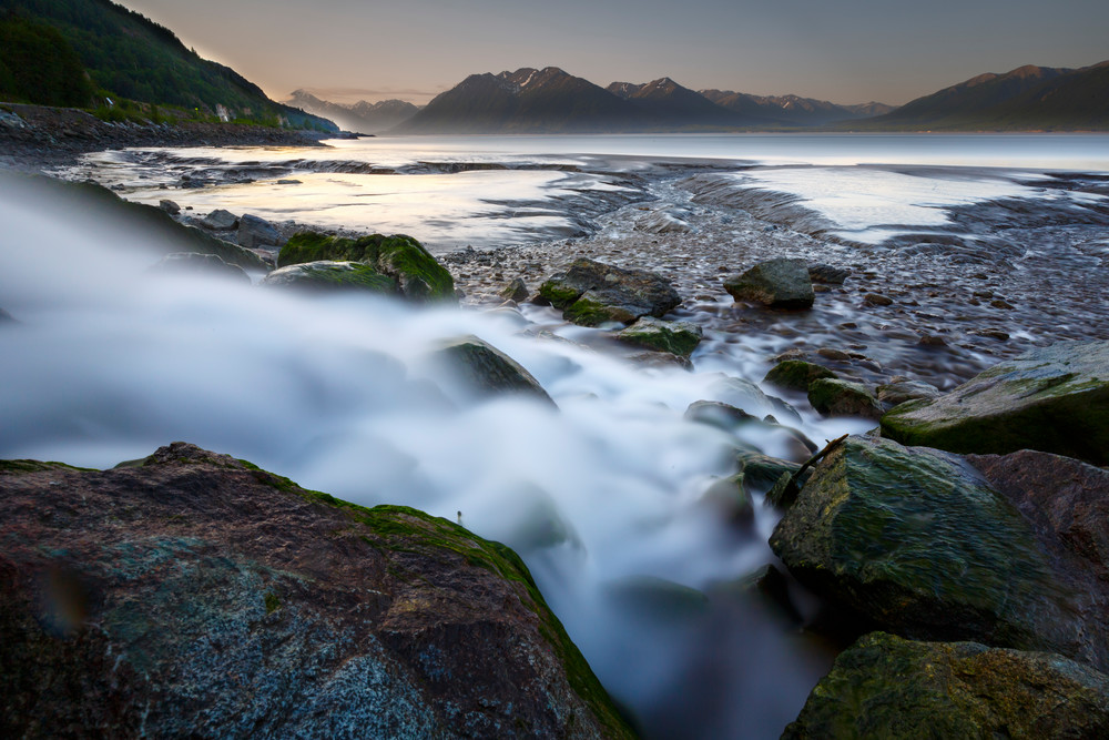 Summer landscape of Rainbow Creek emptying into Turnagain Arm at low tide with Kenai Mountains in background.   June 2015

(C) Jeff Schultz/ Schultzphoto.com