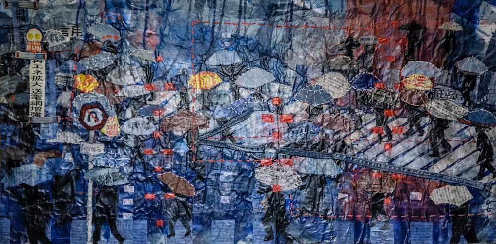 Shibuya Rain” by Muffy Clark Gill is from a series of mixed media artwork.  Chaos, clutter, and color were feelings evoked while viewing the scenes in transit at Shibuya Crossing Viewing the original scene from a train station during a rain storm, I