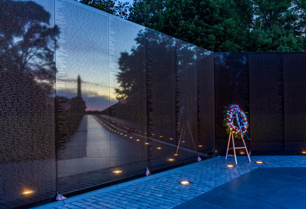 Vietnam Memorial with Reflection of Washington Monumnent at Sunrise