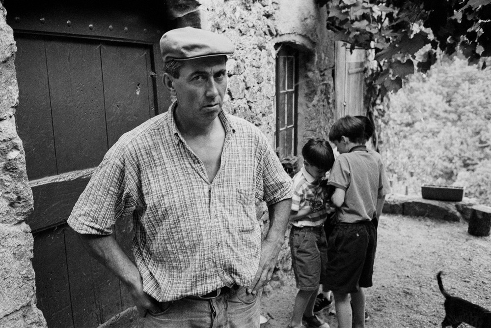 Les Vignolles, France - 30 July 1998. A farmer and his children outside their home near Les Vignolles in the Cécvennes in the south of France. His wife is a cheesemaker, and makes pelardon, a local goat cheese.