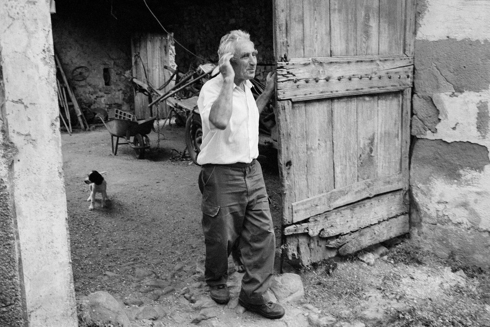 Ste.-Croix-de-Caderle, France -  31 July 1998. Aimé Volpelière greeting visitors from the door of his barn. Volpelière is a farmer and hunter.