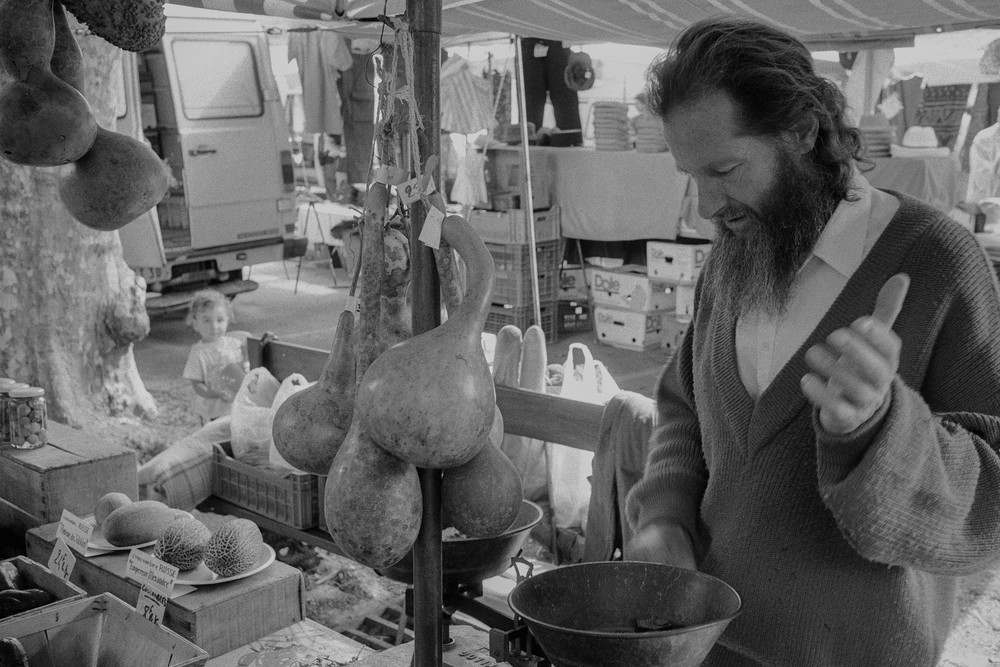 La Salle, France - 3 August 1998. A farmer and vendor in the Cévennes selling his produce on market day in Lasalle.