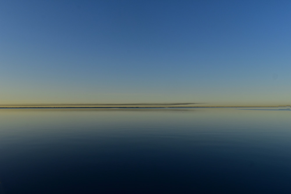 Tranquil blue seascape, horizon, sky