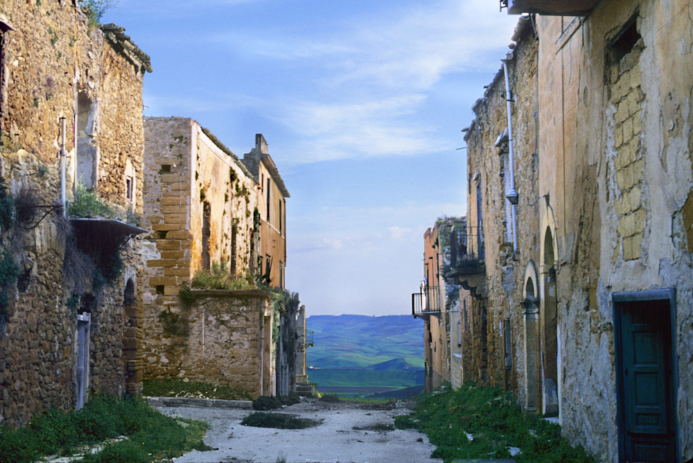 Old town of Poggioreale in Sicily, Italy overlooking the Sicilan countryside. Ruined in the 1960s earthquake. Sicily (Italian: Sicilia [siˈtʃiːlja]) is the largest island in the Mediterranean Sea; along with surrounding minor islands, it constitutes
