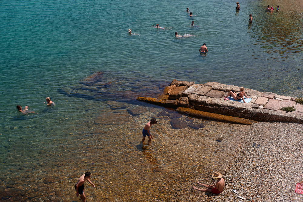 Color photograph of swimmers in Corfu.  