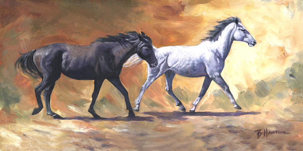 Black and white horses running against abstract background