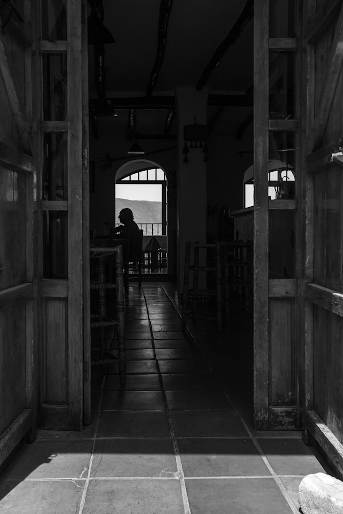 Silhouette of a man sitting in a restaurant