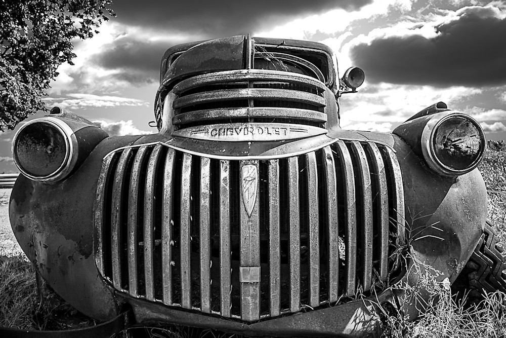 This old Chevy truck was photographed sitting in a field on the way to an old sugar mill. 