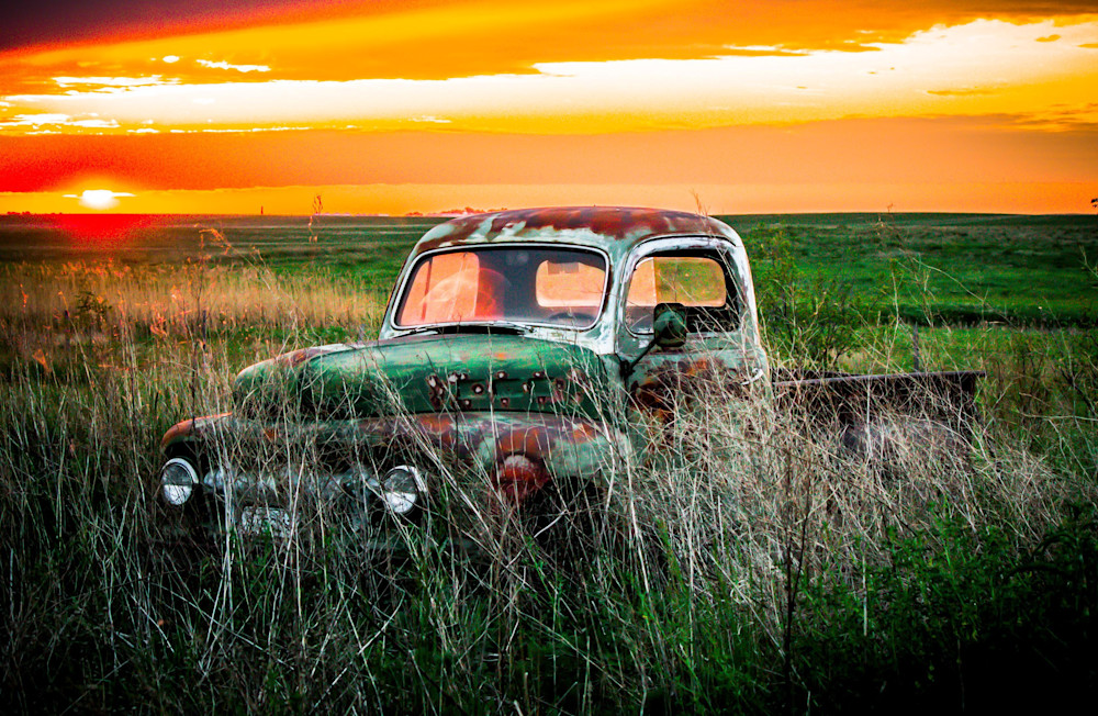 Old rusty truck on the prairie at sunset painting art