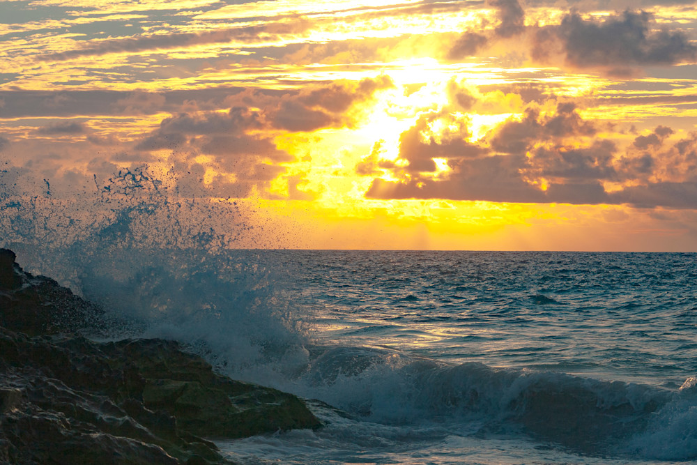 Waves hit the beach during a Bermuda Sunrise