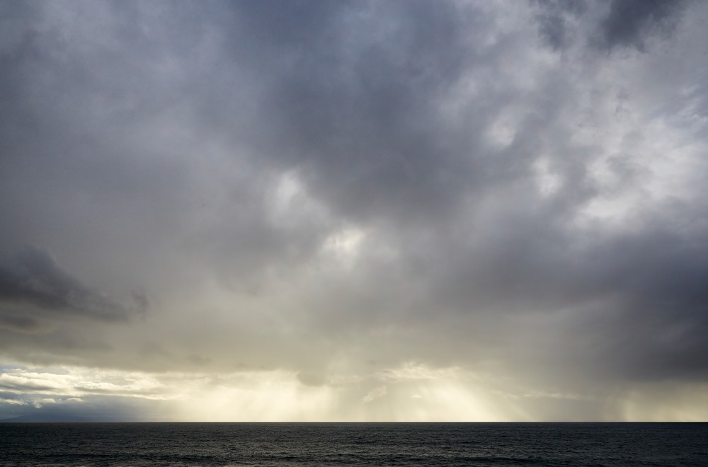 John E. Kelly Fine Art Photography – Backlit Rain - Image 16 (sixteen) - Ocean Sky
