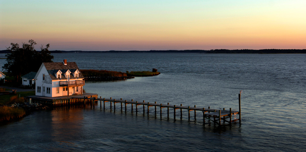 The sun sets over Hooper Island during calm Fall day on Chesapeake Bay, Maryland.