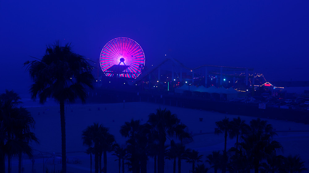 Santa Monica Pier in Santa Monica, California on a brisk and foggy September evening.