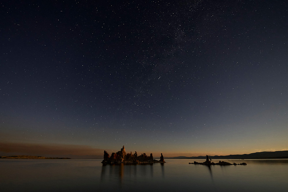 A beautiful night-scape photograph of the milky way above the tufa structures of Mono Lake in Lee Vining, California.