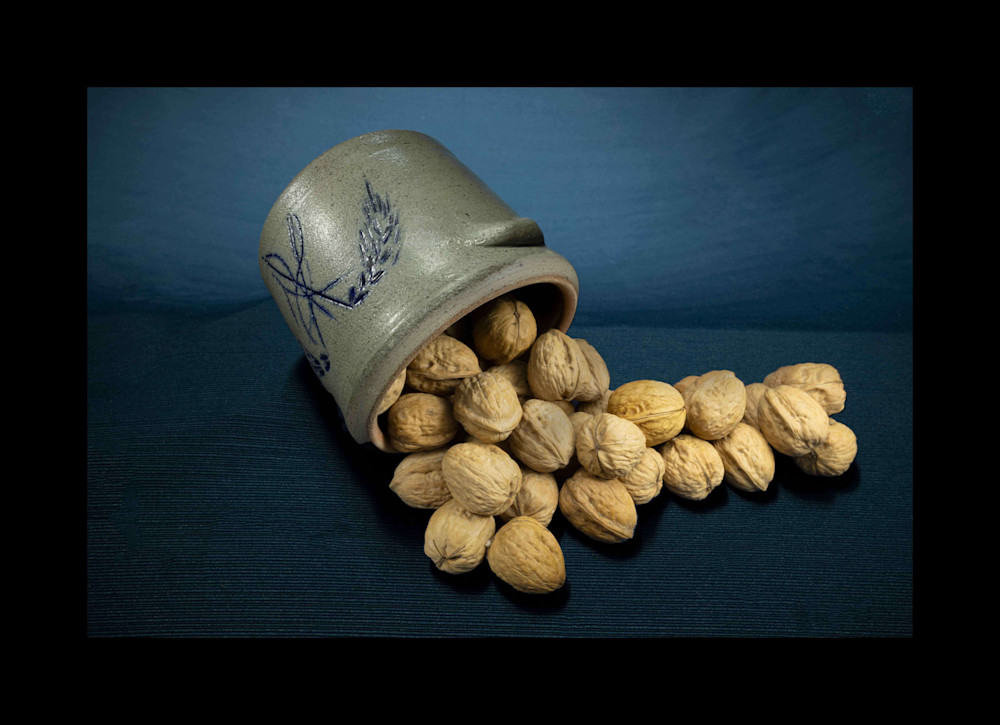 A Fine Art Photograph of Overflowing Walnuts by Michael Pucciarelli