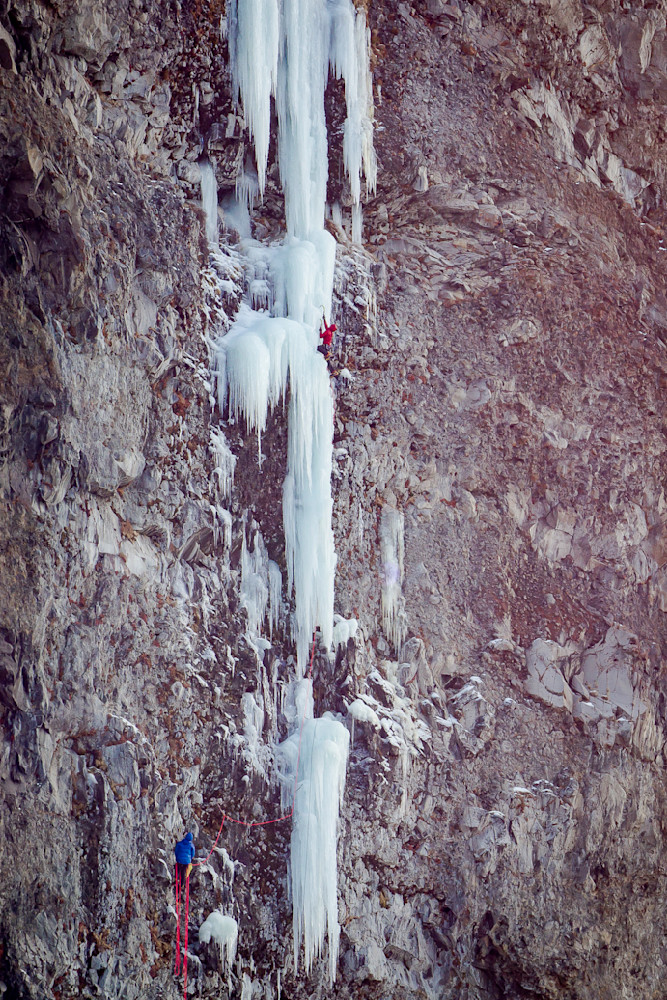 Justin Griffin and Kyle Dempster climbing the Hyalite classic "Winter Dance" in Hyalite Canyon.