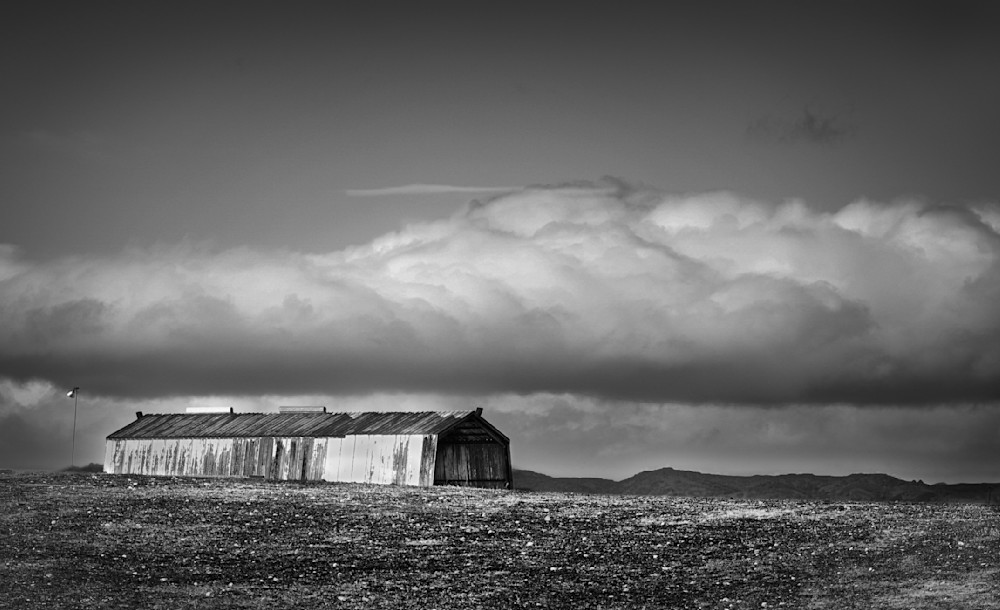 Snow-bearing clouds lower themselves over Yolo County farmland between winter storms.
