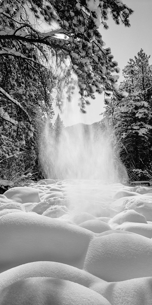 Art photograph of wind-driven snowfall over Big Thompson River