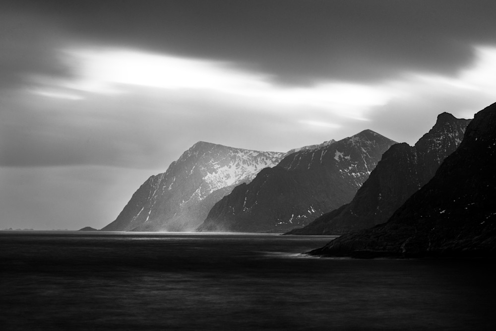 The Maelstrom. Layers of fjords on the ocean in black and white in Lofoten, Norway