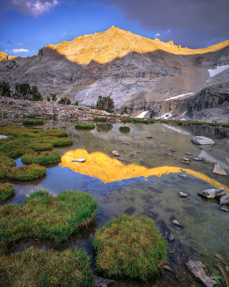 The peaks of the Pioneer mountian range reflect into Boulder Lake.
