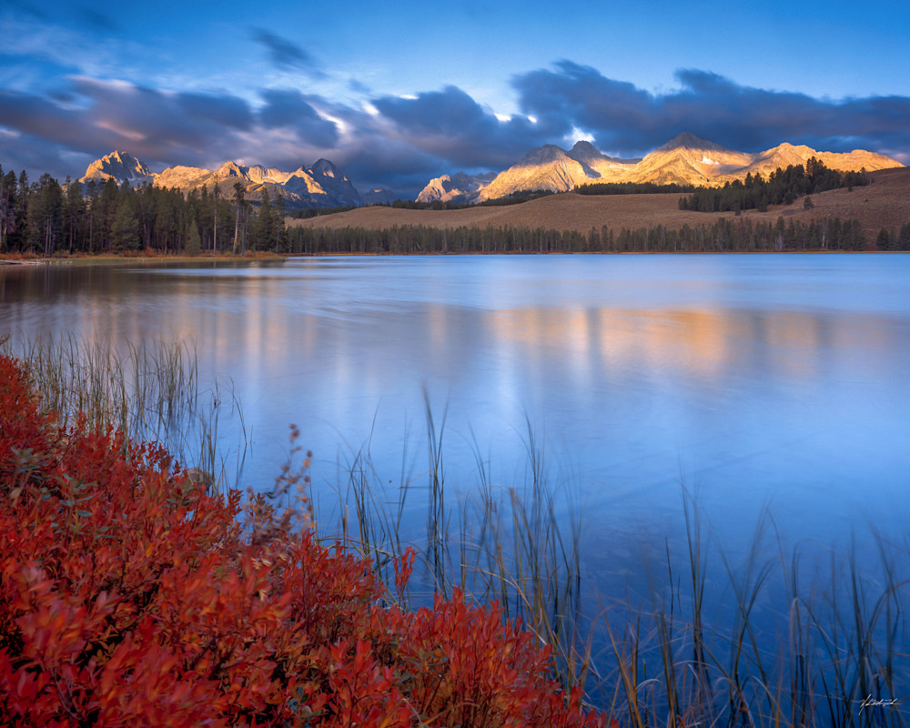 The granite peaks of the Sawtooth Range reflect into Little Redfish Lake in the Sawtooth Wilderness.