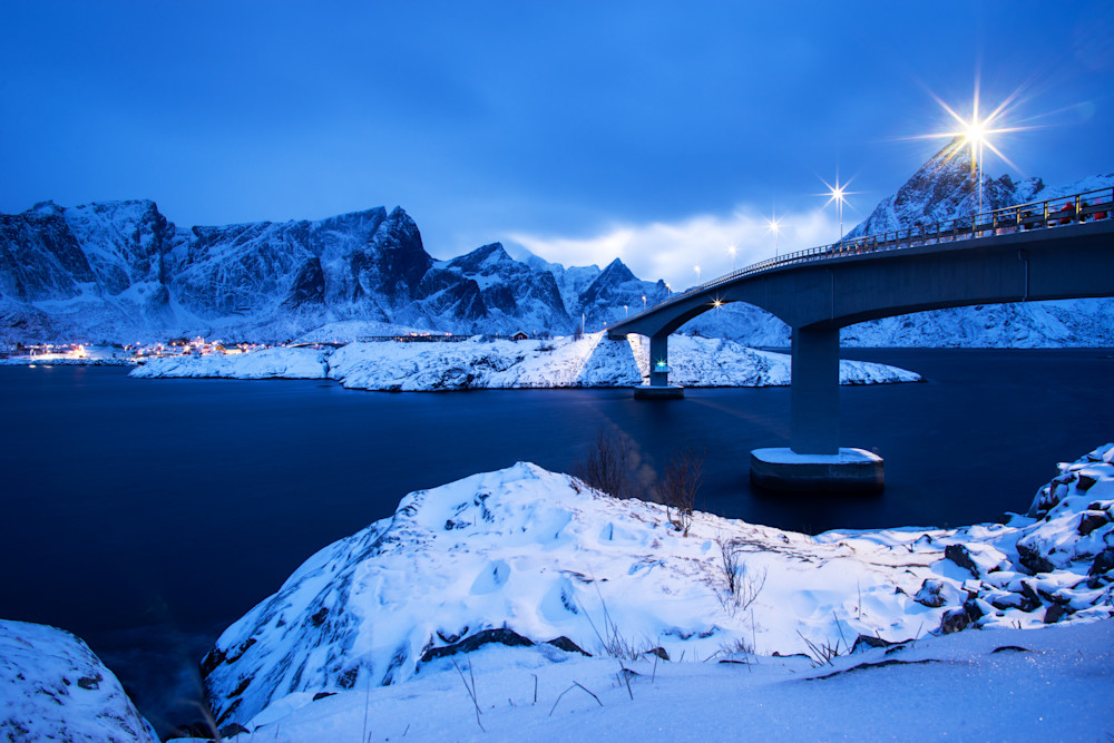 A bridge spans a fjord in this Nighttime in Lofoten, Norway