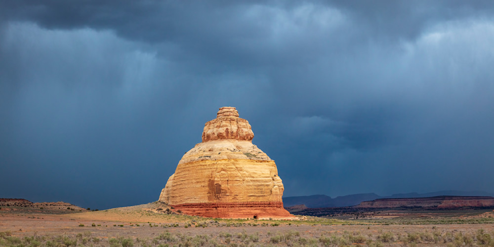 "Utah's Majestic Sandstone Formation: A Beehive-Like Wonder Amidst Dramatic Skies"