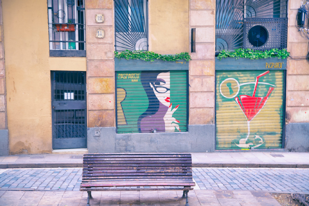 Street Art, Barcelona, Spain featuring lady wearing eyeglasses and a giant Martini glass.
