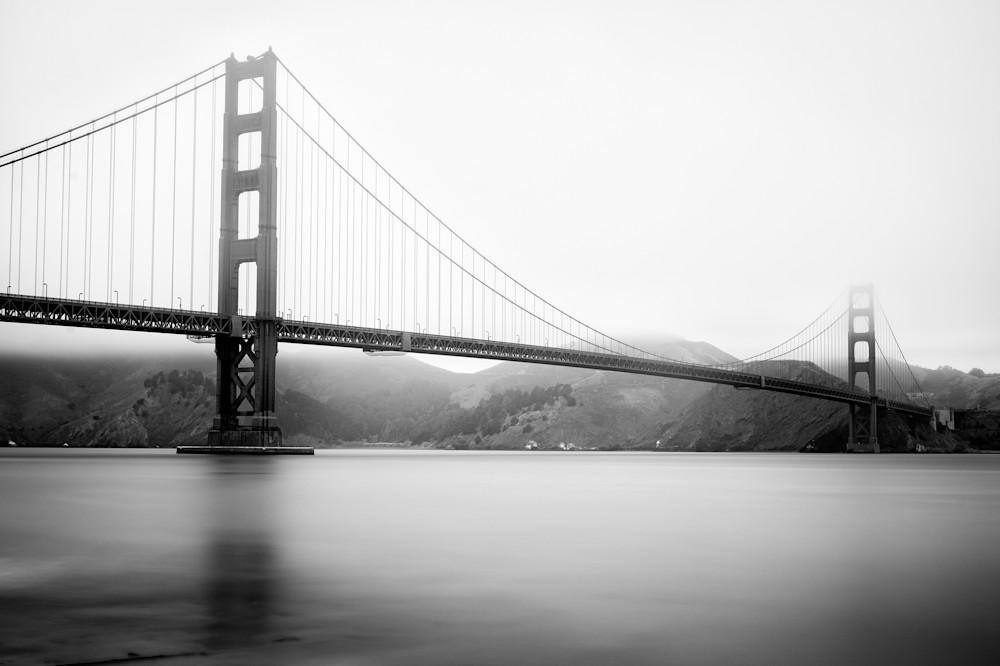 A black and white long exposure photograph of the Golden Gate Bridge