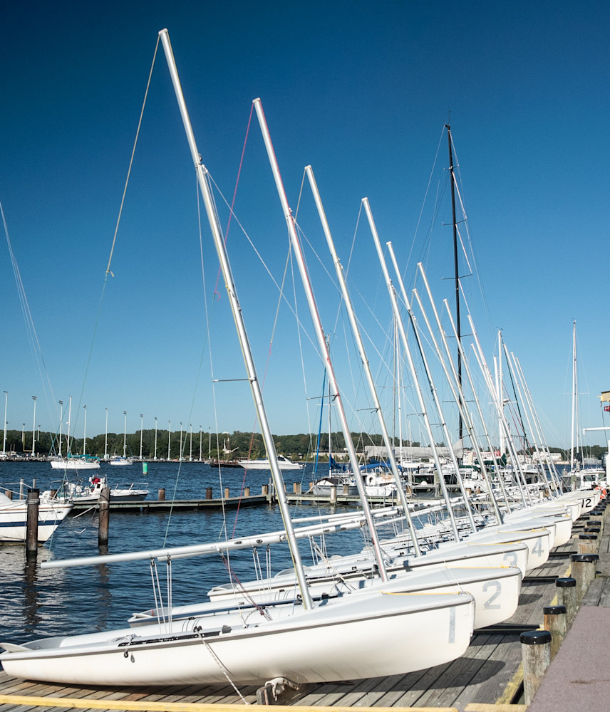 Line of identical small sailboats